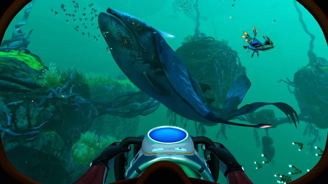 Screenshot from Subnautica showing a massive alien whale creature underwater