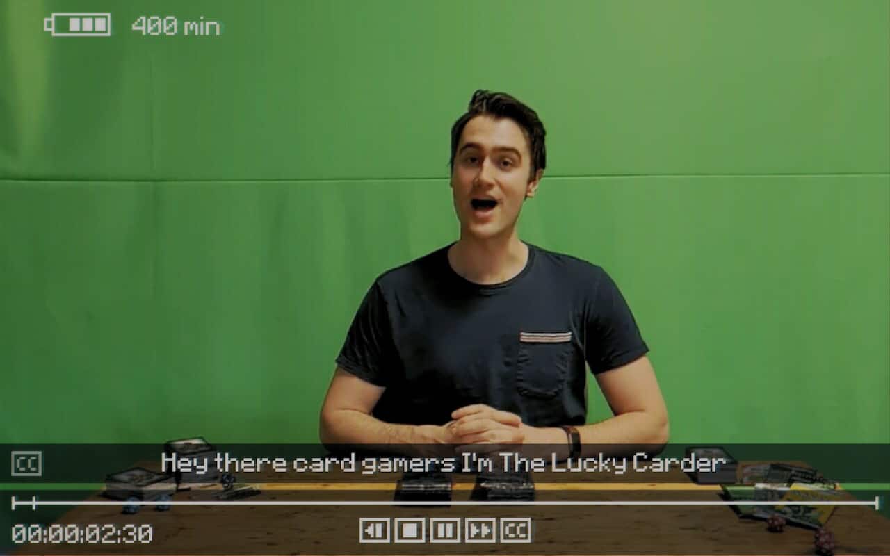 Screenshot of The Lucky Carder in Inscryption, a faux-YouTuber on a green screen background.